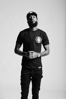 Nipsey Hussle Is Looking Down Head Covered With Black Cloth Wearing Stud In  Ear HD Music Wallpapers  HD Wallpapers  ID 38451